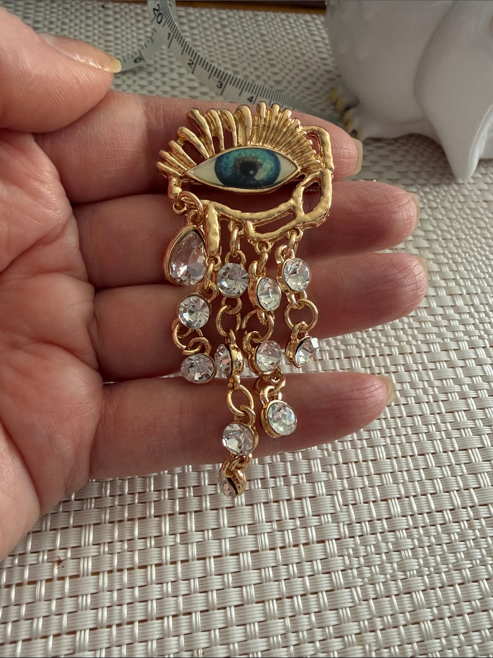 Gold-Tone Blue Eye Dangle Brooch with Crystal Drops